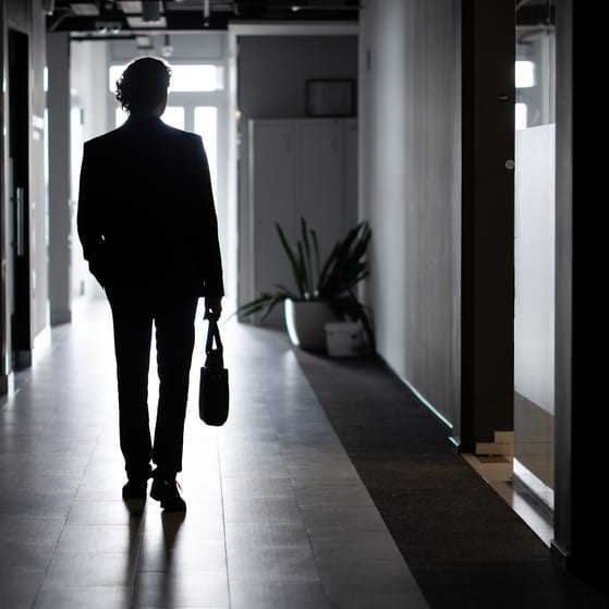 A charity trustee leaves a building after disqualification