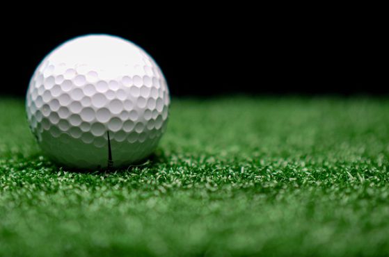 A golf ball on artificial grass