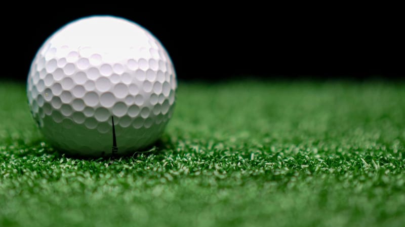 A golf ball on artificial grass