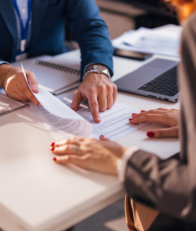 A lawyer explains a legal document to a client