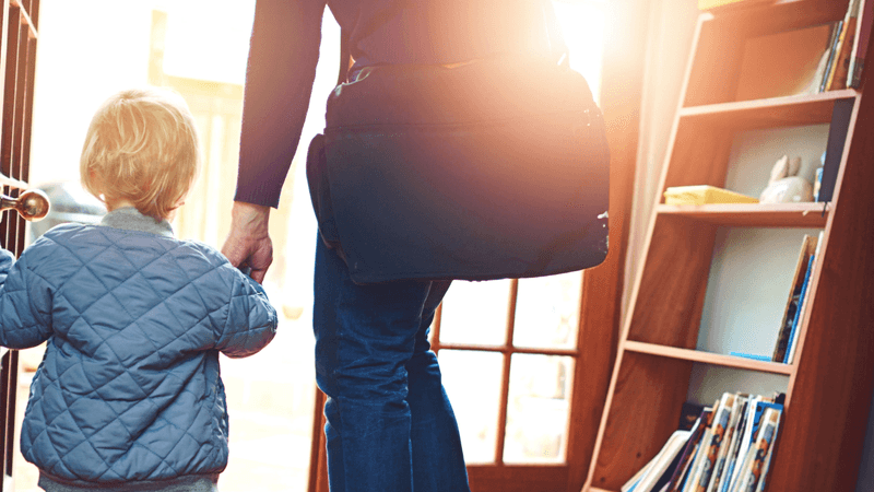 A parent and child leave the house