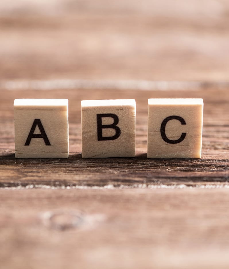 ABC alphabet concept small blocks on wooden surface