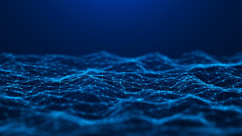 A digital abstract of a blue 3D wireframe landscape with interconnected points and lines forming waves against a dark blue background.