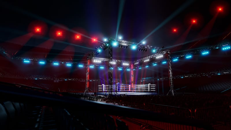 Boxing ring lit up in huge arena
