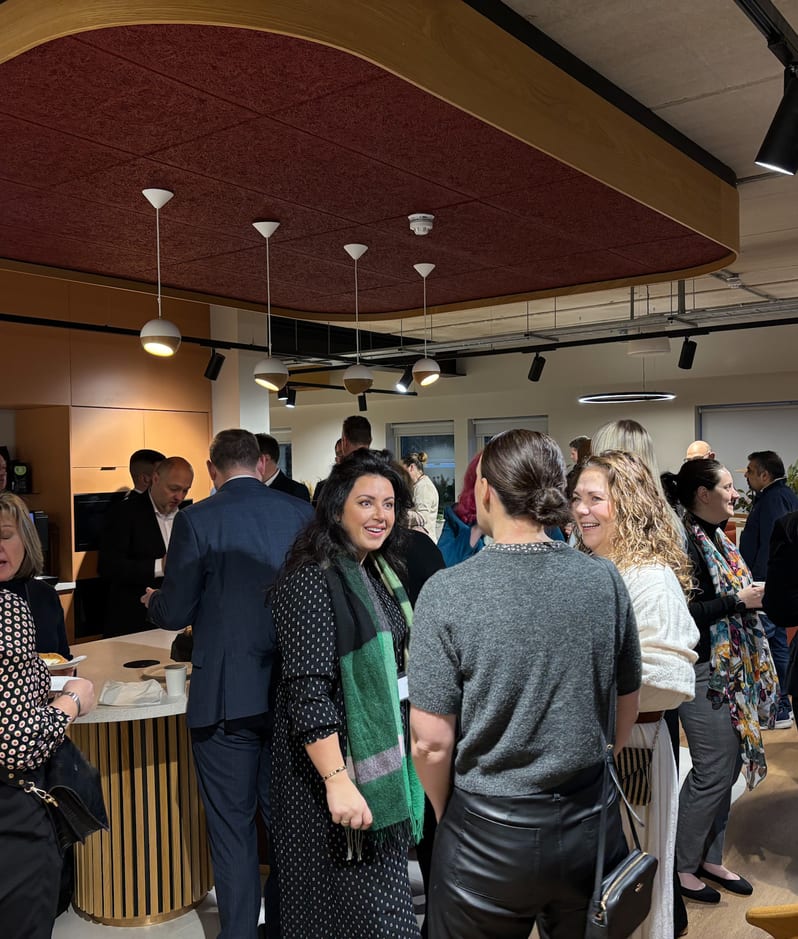 Business Club networking event with people gathered in Brabners Lancashire office