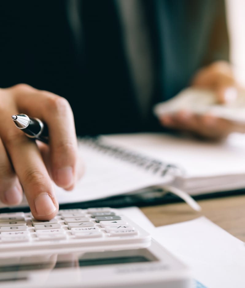 Businessman using calculator insolvency concept