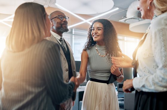 Colleagues celebrate a business deal