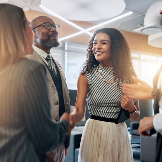 Colleagues celebrate a business deal