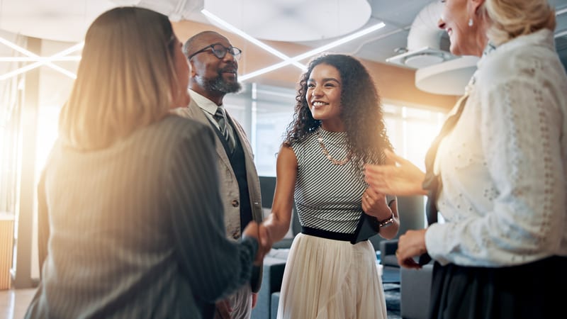 Colleagues celebrate a business deal