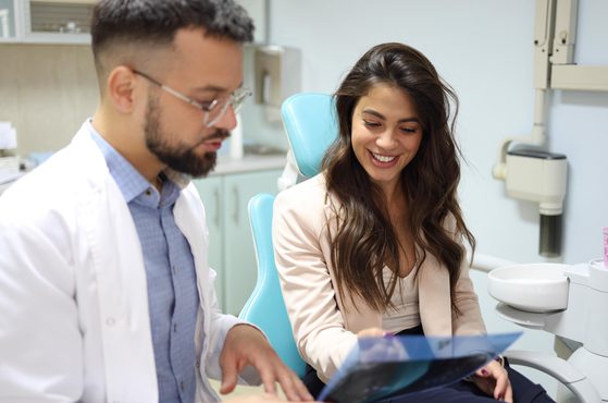 Dental patient reviewing x rays