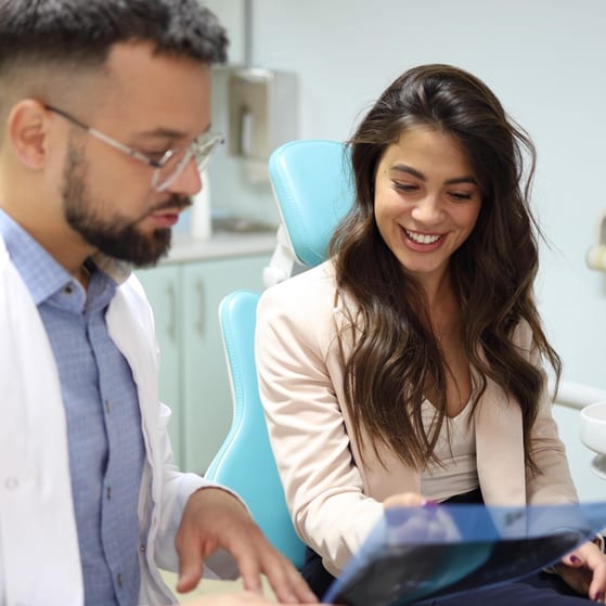 Dental patient reviewing x rays
