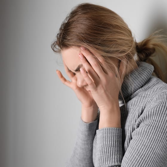 Duty of care woman upset with hands on head
