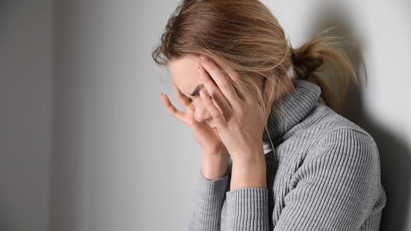 Duty of care woman upset with hands on head