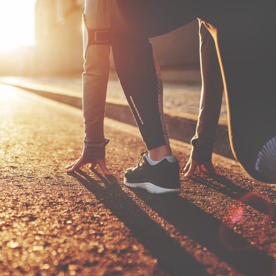 Female athlete preparing to sprint