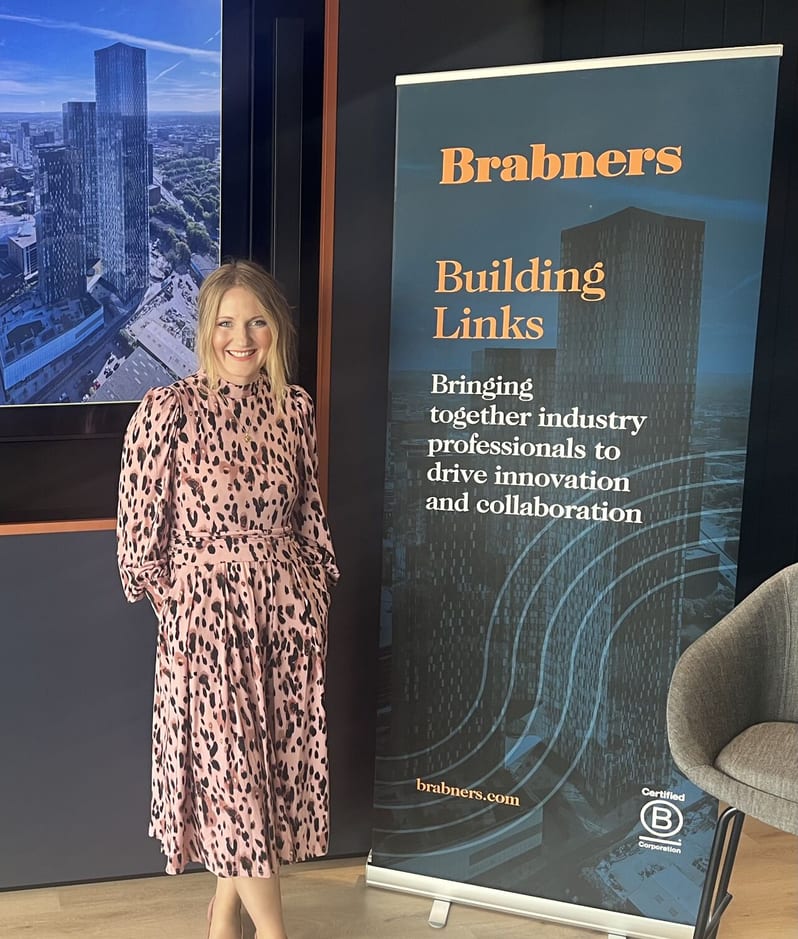 Jennie Jones at Brabners Building Links event with roller banner