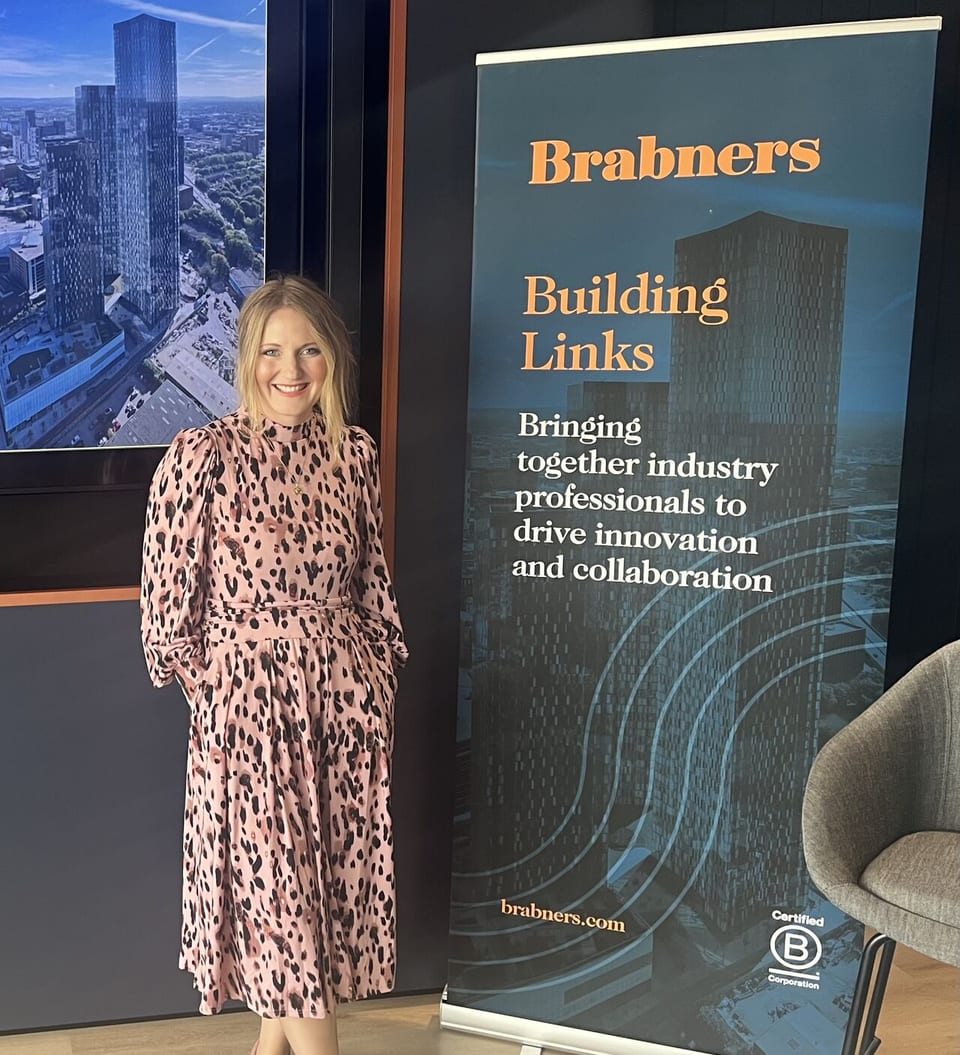 Jennie Jones at Brabners Building Links event with roller banner