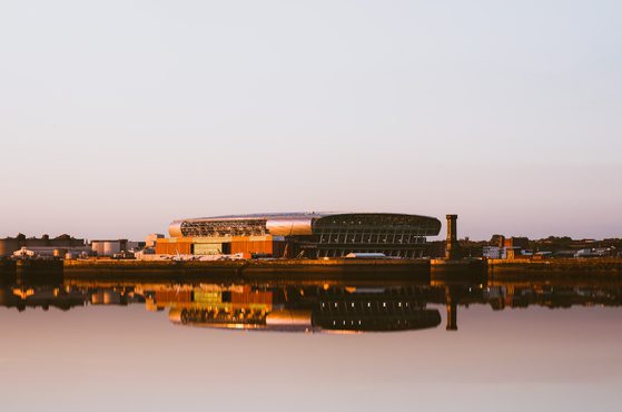 Liverpool UK June 2024 Everton football club new bramley moore dock premier league stadium during sunset with reflection in mersey river