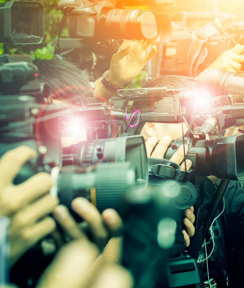 Paparazzi crowd of journalists with cameras and flashes