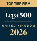 A beige and dark blue certificate design with "Top Tier Firm" at the top, "Legal 500 United Kingdom 2026" in the centre, on a dark blue background.