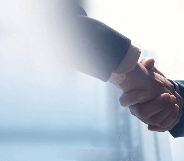 handshake between two business executives