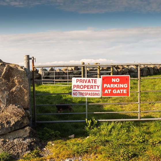 No trespassing sign on field gate