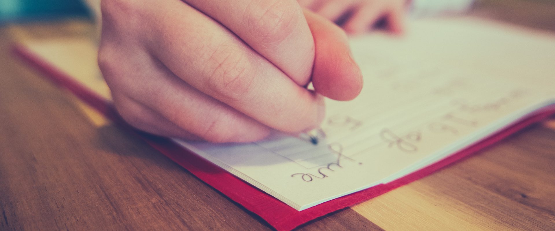 School girl writing in note book