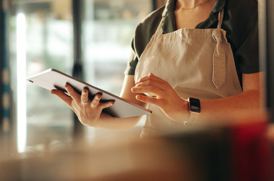 Shopkeeper using tablet device