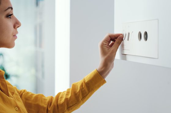 Woman setting boiler