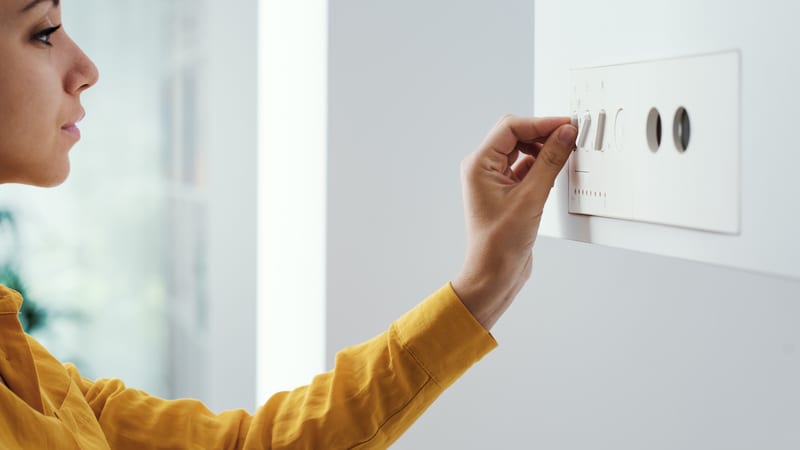 Woman setting boiler