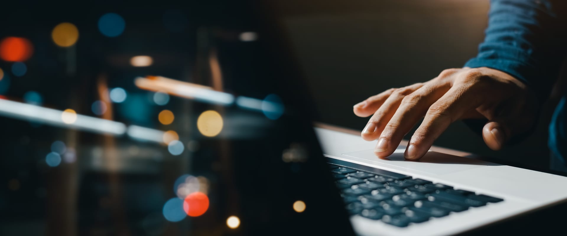 Working on laptop at night bokeh