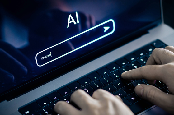 Hands typing on a laptop keyboard with a screen displaying an AI prompt and a create button.