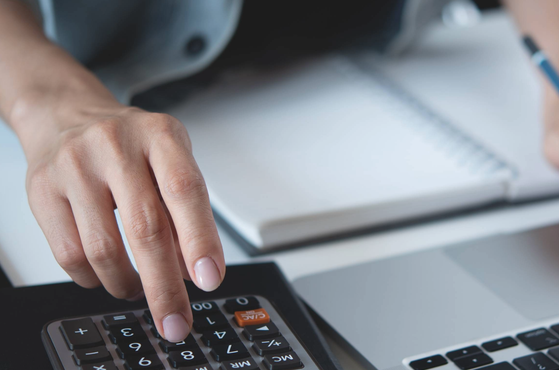 An employer calculates their rising costs