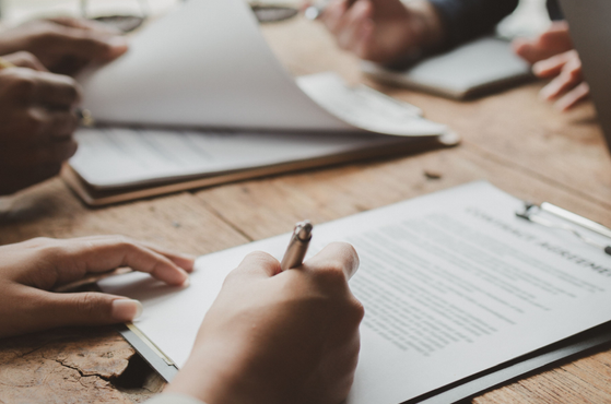 Public procurement professionals sign contract