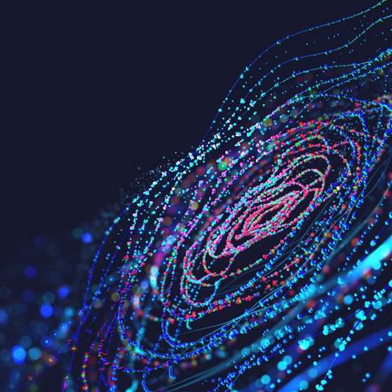 A digital abstract image of glowing multicoloured particles forming concentric spirals against a dark background, resembling a futuristic data or neural network.