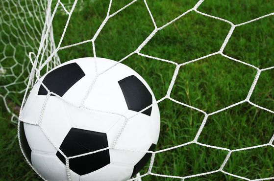 Football caught in the back of the net square