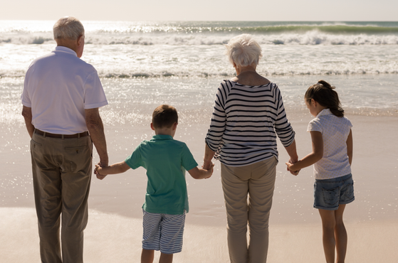 Grandparents with grandchildren at the beach