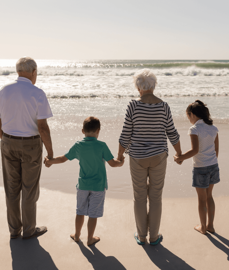 Grandparents with grandchildren at the beach