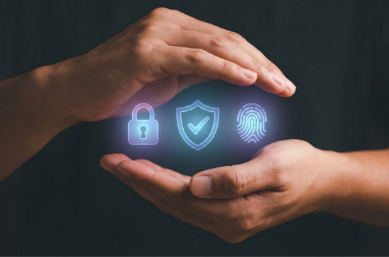 Two hands gently cradle glowing security icons—a padlock, a shield with a check mark, and a fingerprint—conveying digital protection, privacy, and safe data handling.