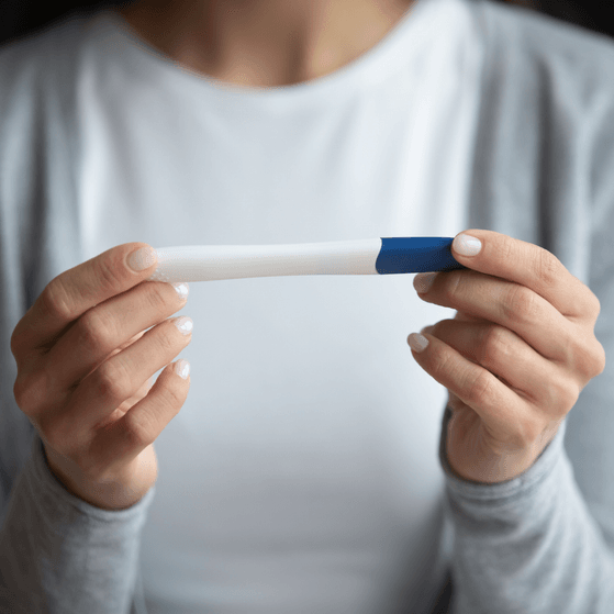 Pregnancy test in womans hands