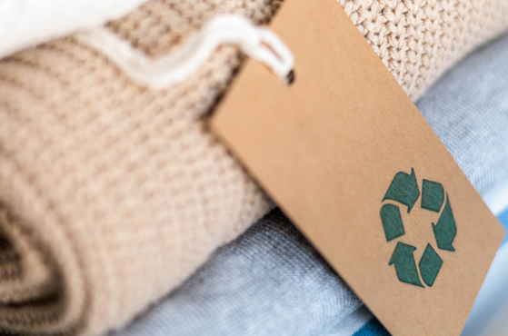 A stack of clothing containing recycled materials for sale