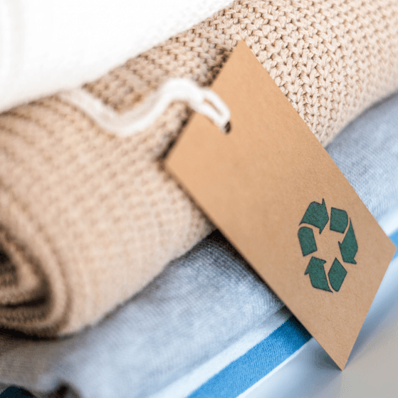 A stack of clothing containing recycled materials for sale