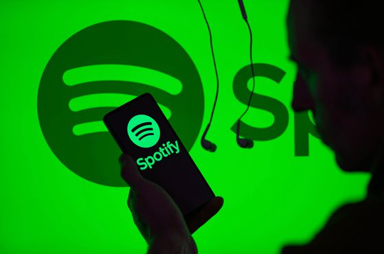 Spotify logo background green with phone graphic