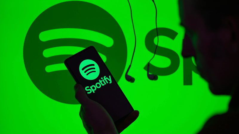 Spotify logo background green with phone graphic